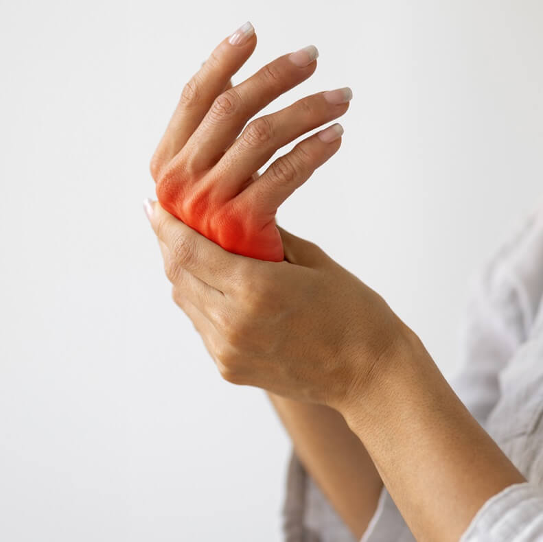 Female hands - left hand massaging the right hand